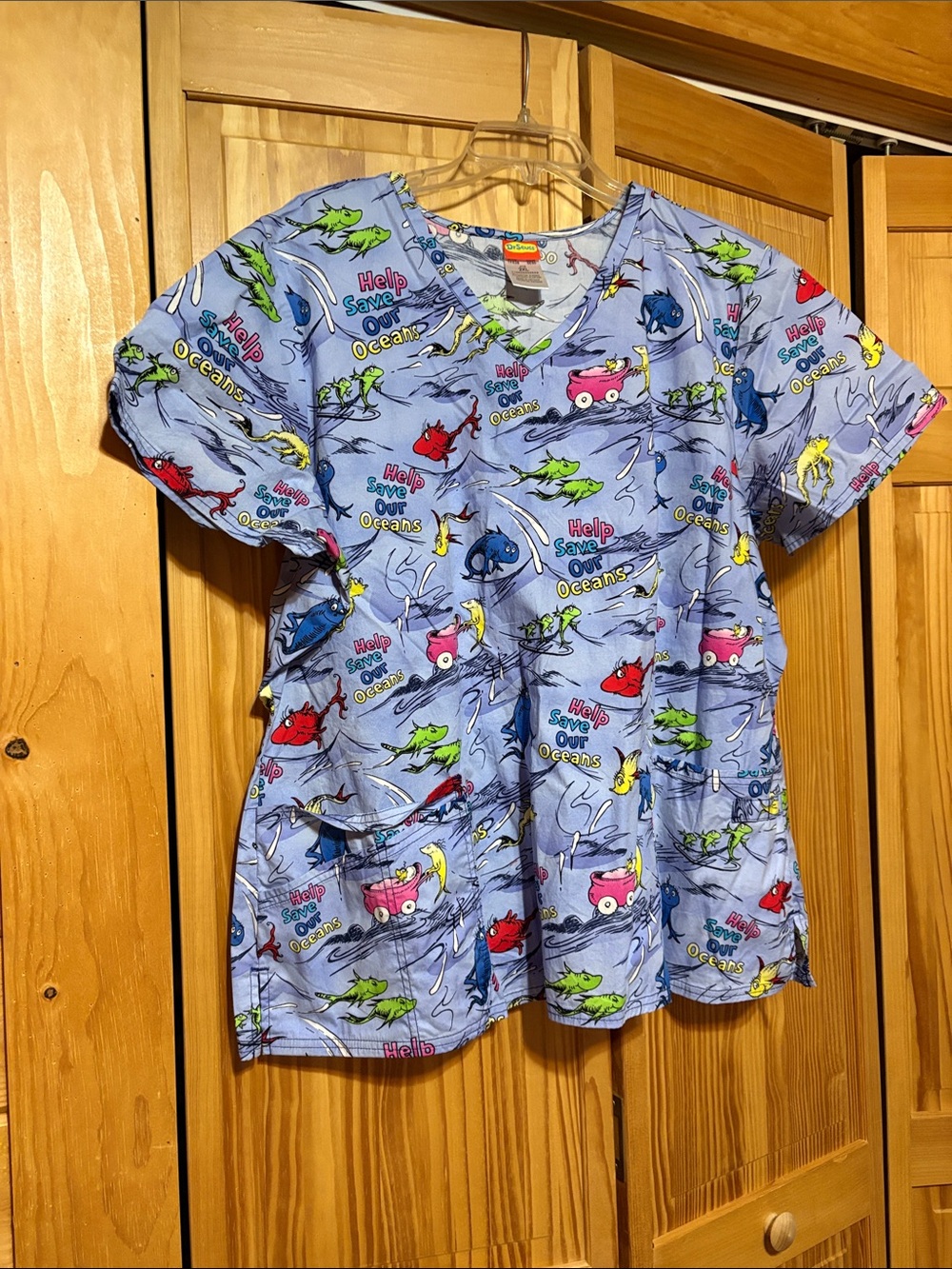 Dr. Seuss Women’s Light Blue Ocean Rescue Scrub Top with Multicolor Prints